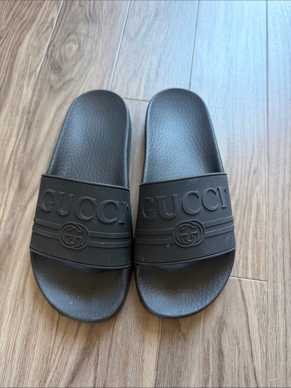 Gucci Black Embossed Logo Slide Sandals